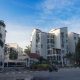 Exterior modern apartemen mewah Mediterania Marina Residence dengan kolam renang, pemandangan laut, dan lokasi strate...